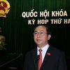 Bộ trưởng Bộ Công an Trần Đại Quang trình bày Báo cáo công tác phòng ngừa, chống vi phạm pháp luật và tội phạm. (Ảnh: Thống Nhất/TTXVN)