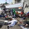 Thi thể các nạn nhân trong vụ đánh bom. (Nguồn: AFP/TTXVN)