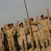 Binh sĩỹ Iraq tại lễ chuyển giao quyền tiếp quản an ninh tại căn cứ Camp Echo, ngày 14/12. (Nguồn: THX/TTXVN)