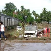 Cảnh ngập lụt ở thành phố Iligan, đảo Mindanao ngày 17/12 sau khi cơn bão Washi tràn qua. (Nguồn: AFP/TTXVN)