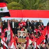 Tuần hành ủng hộ chính phủ tại Syria. (Nguồn: THX/TTXVN)
