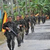 Các tay súng MILF tuần tra tại căn cứ Darapan, tỉnh Sultan Kudarat thuộc đảo Mindanao, miền nam Philippines ngày 5/9/2011. (Nguồn: AFP/ TTXVN)
