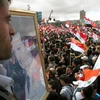 Tuần hành ủng hộ chính phủ Syria tại Damascus ngày 15/3. (Nguồn: THX/TTXVN)