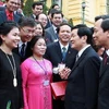 Chủ tịch nước Trương Tấn Sang gặp mặt thân mật 100 Bí thư Chi bộ tiêu biểu thuộc Đảng bộ Khối các cơ quan Trung ương. (Ảnh: Nguyễn Khang/TTXVN)