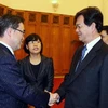 Thủ tướng Nguyễn Tấn Dũng tiếp ông Hideaki Uhmura, Tỉnh trưởng tỉnh Aichi (Nhật Bản) nhân chuyến thăm và làm việc tại Việt Nam. (Ảnh: Nguyễn Dân/TTXVN)