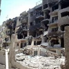 Cảnh tàn phá tại trung tâm thành phố Homs (Syria) ngày 26/7 sau các cuộc xung đột. (Nguồn: AFP/TTXVN)