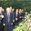 Tổng Bí thư Nguyễn Phú Trọng thăm Vườn lan quốc gia Singapore và dự Lễ đặt tên hoa phong lan. (Ảnh: Trí Dũng/TTXVN)