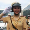 TP.HCM: Nữ cảnh sát giao thông tham gia dẫn đoàn
