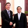Thủ tướng Thongsinh Thammavong tiếp ông Phạm Văn Vọng. (Ảnh: Hoàng Chương/Vietnam+)