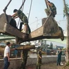 Cơ quan chức năng tỉnh Bạc Liêu xử lý quả bom nặng trên 113kg. (Nguồn: Nhandan.com.vn)