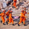 Diễn tập cứu hộ đối phó với động đất ở Trung Quốc. (Nguồn: THX/TTXVN)