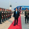 Lễ đón Thủ tướng Nguyễn Tấn Dũng tại Sân bay Quốc tế Vạttày, thủ đô Vientiane, ngày 12/3. (Ảnh: Đức Tám/TTXVN)