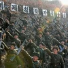 Các thành viên Đội cận vệ Đỏ Công-Nông Triều Tiên tham gia cuộc diễn tập quân sự tại một địa điểm bí mật. (Nguồn: AFP/TTXVN)
