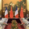 Tổng Bí thư, Chủ tịch Trung Quốc Tập Cận Bình (thứ 2 trái) và Tổng thống Pháp Francois Hollande (thứ 2 phải) trong cuộc hội đàm tại Bắc Kinh. (Nguồn: AFP/TTXVN)