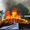 Thiêu hủy ma túy tại Lào. (Ảnh: Hoàng Chương/Vietnam+)