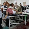 Điều trị cho người bị thương sau vụ xung đột, tại Cairo ngày 8/7. (Nguồn: THX/TTXVN)