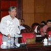 Bộ Trưởng Bộ Tư pháp Hà Hùng Cường trình bày tờ trình tại phiên họp. (Ảnh: Phương Hoa/TTXVN)
