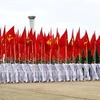 Khối Hồng kỳ với 200 vận động viên, chiến sỹ quân đội tham gia. (Ảnh: Trung Hiền/Vietnam+)