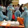 Diễn tập lập chốt kiểm dịch, khoanh vùng dịch cúm tại Sơn La. (Ảnh: Điêu Chính Tới/TTXVN)
