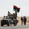 Lực lượng nổi dậy trên đường tới thành phố Bani Walid, cách Tripoli gần 40km về phía Đông Nam ngày 8/9. (Nguồn: THX/TTXVN)