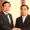 Thủ tướng Thongsin Thammavong tiếp Bộ trưởng Nguyễn Bắc Son. (Ảnh: Hoàng Chương/Vietnam+)