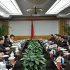 Đoàn đại biểu cấp cao TTXVN hội đàm với Nhân dân Nhật báo Trung Quốc. (Ảnh: Quang Đức/TTXVN)