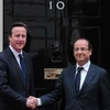 Thủ tướng Anh David Cameron (trái) vàTổng thống Francois Hollande tại London. (Nguồn: AFP/TTXVN)