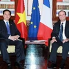 Thủ tướng Nguyễn Tấn Dũng gặp Tổng thống Pháp Francois Hollande bên lề Hội nghị Cấp cao Diễn đàn Hợp tác Á-Âu lần thứ 9 (ASEM 9). (Ảnh: Đức Tám/TTXVN)