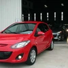 Xe du lịch Mazda 2 xuất xưởng để xuất sang Lào. (Ảnh: Nguyễn Sơn/Vietnam+)