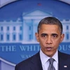 Ông Obama mắt đỏ hoe phát biểu trên truyền hình bày tỏ sự tiếc thương vô hạn. (Nguồn: AFP) 