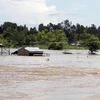 Nước lũ dâng cao ngập mái nhà tại huyện Hồng Ngự (Đồng Tháp). Ảnh minh họa. (Nguồn: TTXVN)