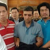  Nghi can vụ đánh bom ở Bangkok, ngày 14/2 - Mohamad Khazaei (giữa) bị lực lượng an ninh Thái Lan bắt giữ. (Ảnh: AFP)