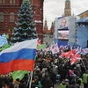 Hàng chục nghìn người đã tham gia míttinh tại trung tâm thủ đô Mátxcơva để ủng hộ ông Putin. (Nguồn: AFP/TTXVN)