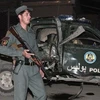 Cảnh sát Afghanistan tại hiện trường một vụ tấn công vào chiếc xe cảnh sát. (Nguồn: AP)