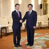 Chủ tịch Trung Quốc Hồ Cẩm Đào (phải) và Bộ trưởng Tài chính Mỹ Timothy Geithner. (Nguồn: AFP/TTXVN)
