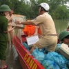Công tác cứu trợ đồng bào miền Trung. (Ảnh minh họa: Bích Huệ/TTXVN)