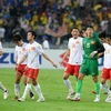 Nỗi buồn thua trận của các cầu thủ Việt Nam trong trận lượt đi. (Nguồn: Quốc Khánh/TTXVN)