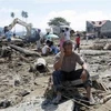Cơn bão Washi khiến nhiều gia đình Philippines điêu đứng. (Ảnh: AP)