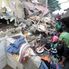 Người dân Philippines đối mặt với hậu quả nặng nề do cơn bão Washi gây ra. (Nguồn: Getty)