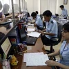 Hải quan Hà Nội mở tờ khai hàng hóa XNK cho doanh nghiệp. (Ảnh: Phạm Hậu/TTXVN)