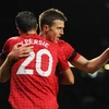 Michael Carrick và Robin van Persie. (Nguồn: Getty)