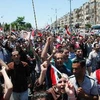 Syria : Tuần hành ủng hộ chính phủ. (Nguồn: AFP/TTXVN)
