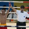 Võ sĩ Nguyễn Phi Long giành chiến thắng trước võ sĩ Mông Cổ Borkhuu Myagmarsuren với tỉ số 2-1. (Ảnh: Thế Anh/TTXVN)