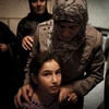 Gia đình của tù nhân Palestine đang chờ người thân. (Nguồn: Getty Images)