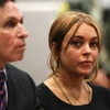 Lohan và luật sư Mark Heller. (Nguồn: EPA)