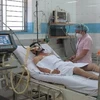 Một bệnh nhân nhiễm cúm A/H5N1 đang điều trị cách ly tại Bệnh viện Nhiệt Đới Thành phố Hồ Chí Minh ngày 7/3. (Ảnh: Phương Vy/TTXVN)