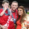 Vợ chồng Rooney và bé Kai. (Nguồn: Getty Images)