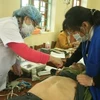 Các bác sĩ và tình nguyện viên đang khám bệnh miễn phí cho người dân tại Hà Nam. (Ảnh minh họa/Nguồn: Internet)