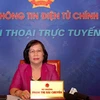 Bộ trưởng Phạm Thị Hải Chuyền trả lời thắc mắc của người dân. (Ảnh: Hồng Kiều/Vietnam+)