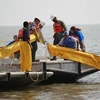 Công tác khắc phục, ngăn chặn dầu loang ở Vịnh Mexico sẽ bị tạm ngừng 2 tuần vì cơn bão Alex. (Ảnh: AFP/TTXVN)